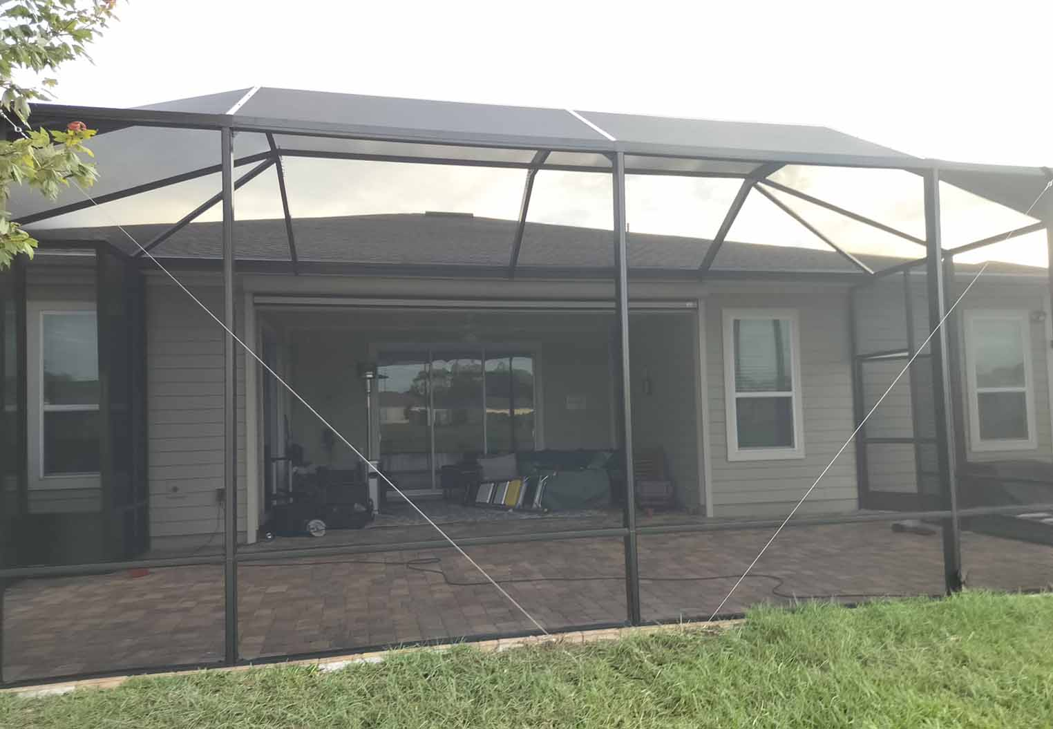 Large custom Screened in patio addition with paver flooring
