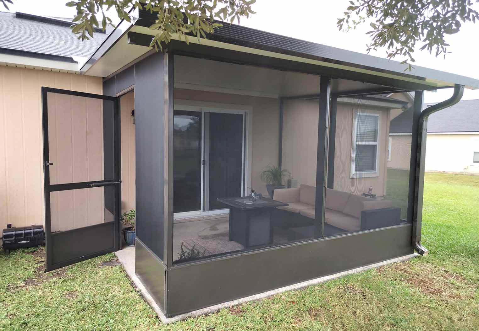 Newly installed screened in lanai on the back of a house