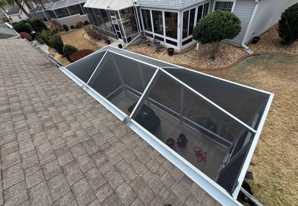 Top view of a screen enclosed backyard patio