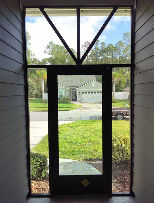 looking out through a resedential screened entry way
