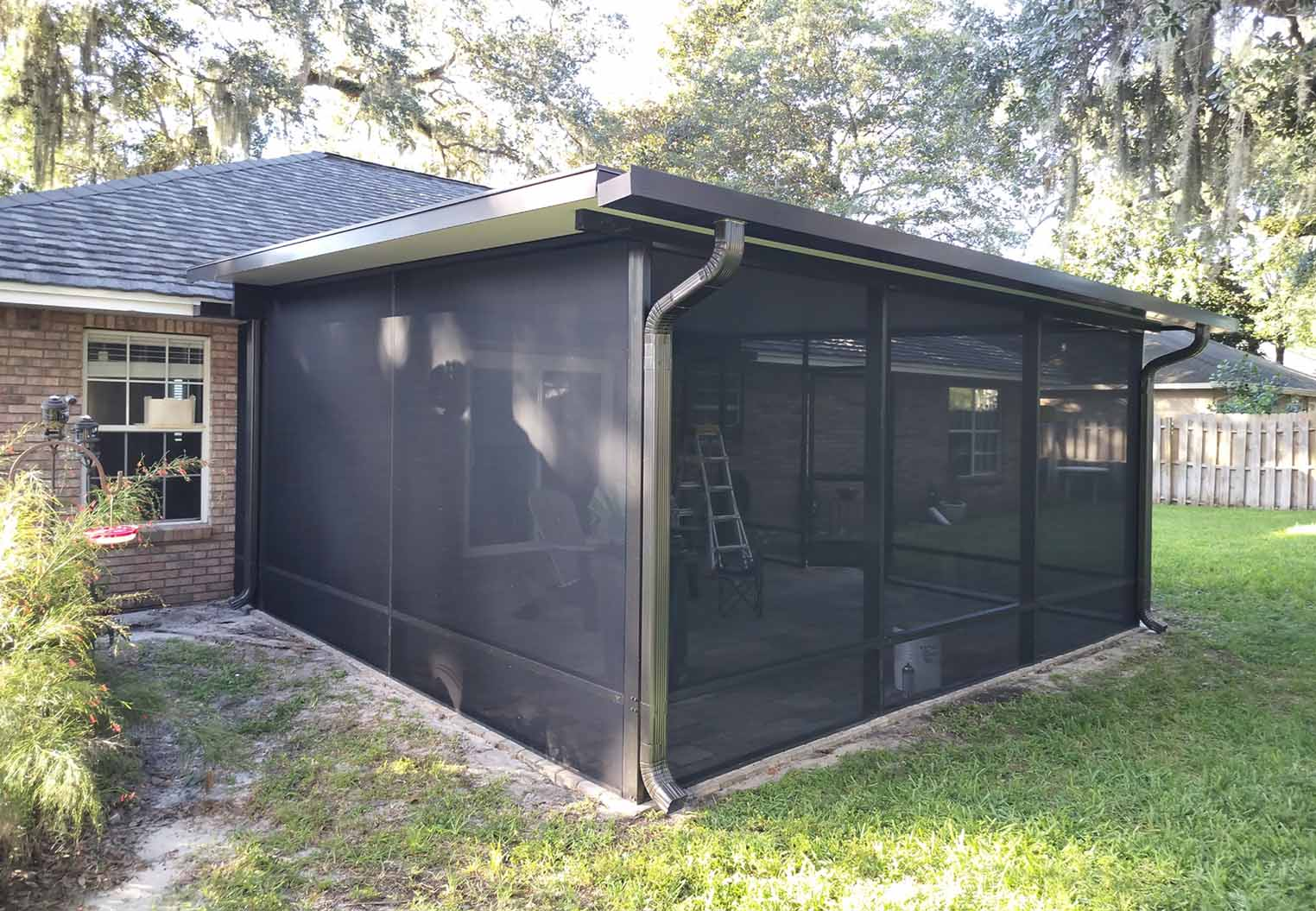 new enclosed lanai addtion with paver flooring and custom water management and gutters