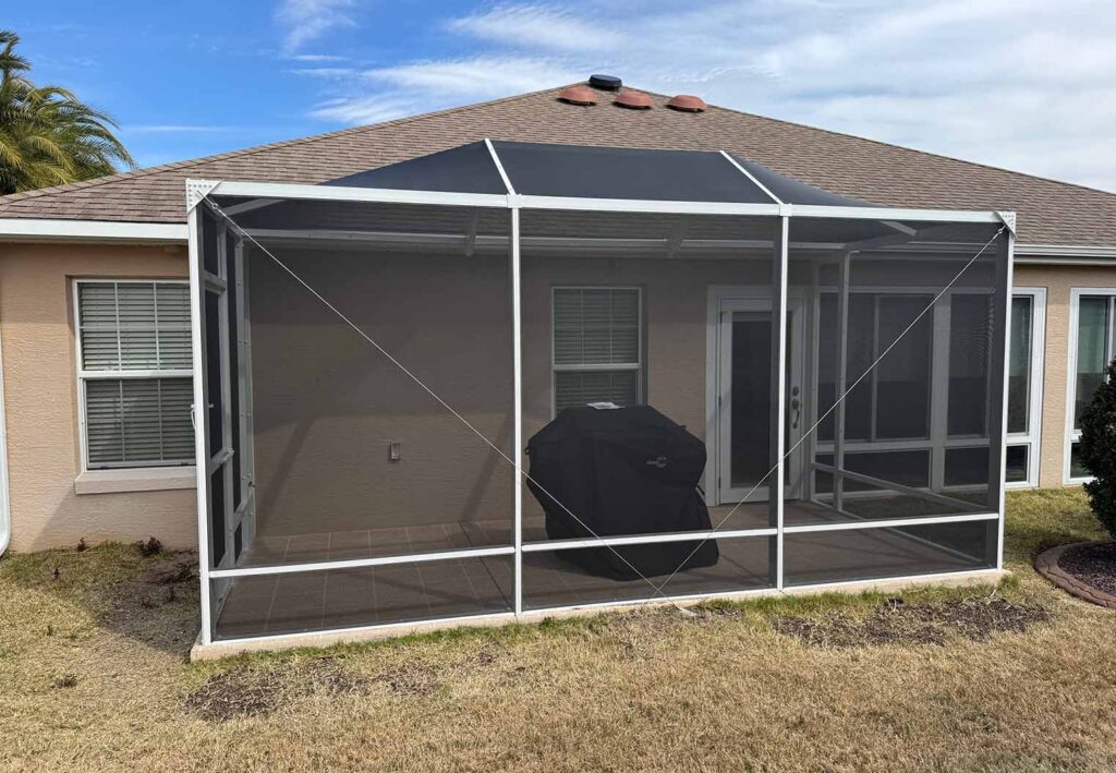 new screen patio enclosure with wile floor and covered grill jpg