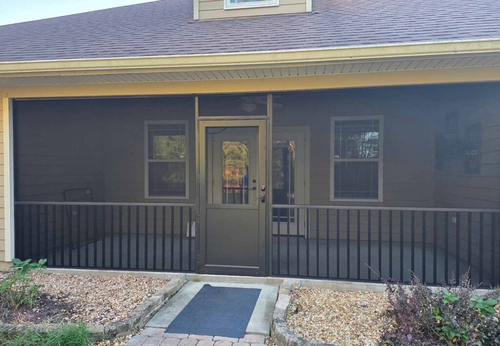 screened in back porch with half railing and reinforced entry door