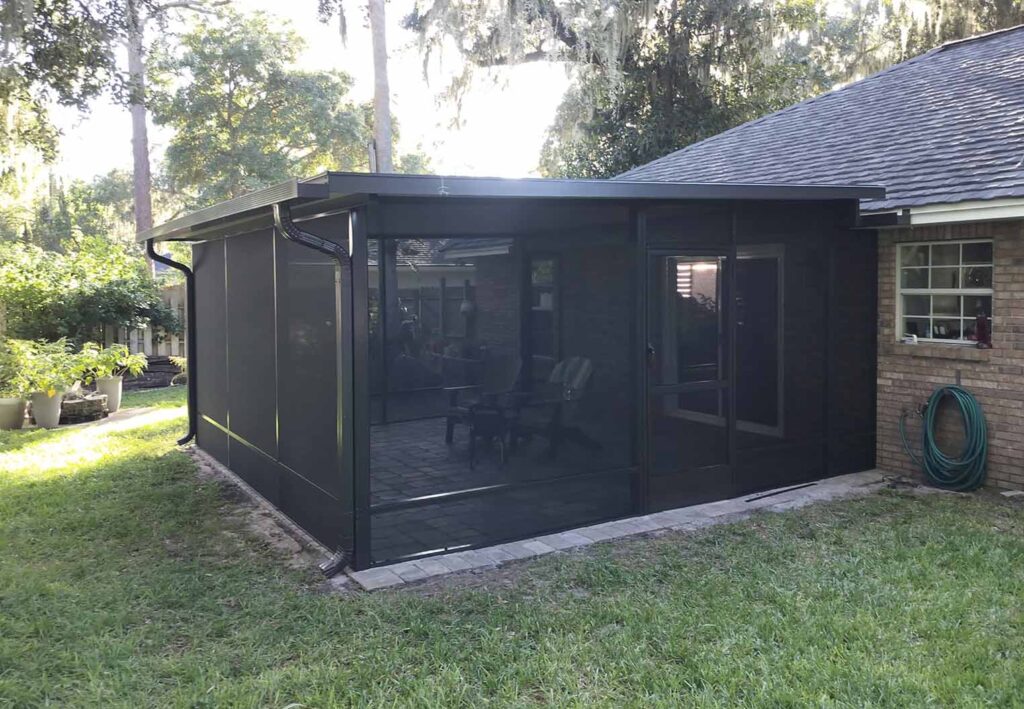 screened in patio addition with custom awning, pavers, and rain water management