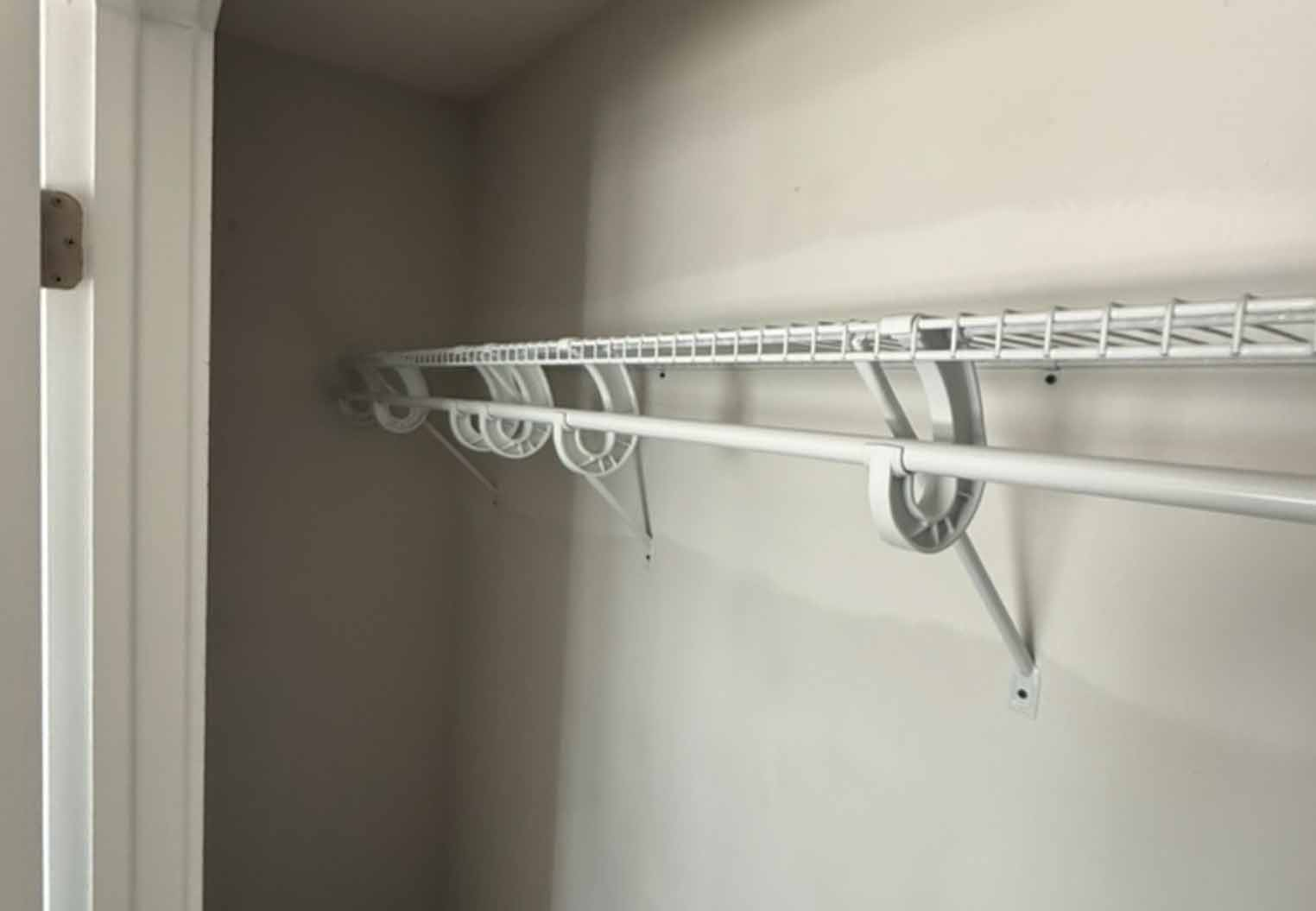 closet remodel with metal shelving and hanging rack