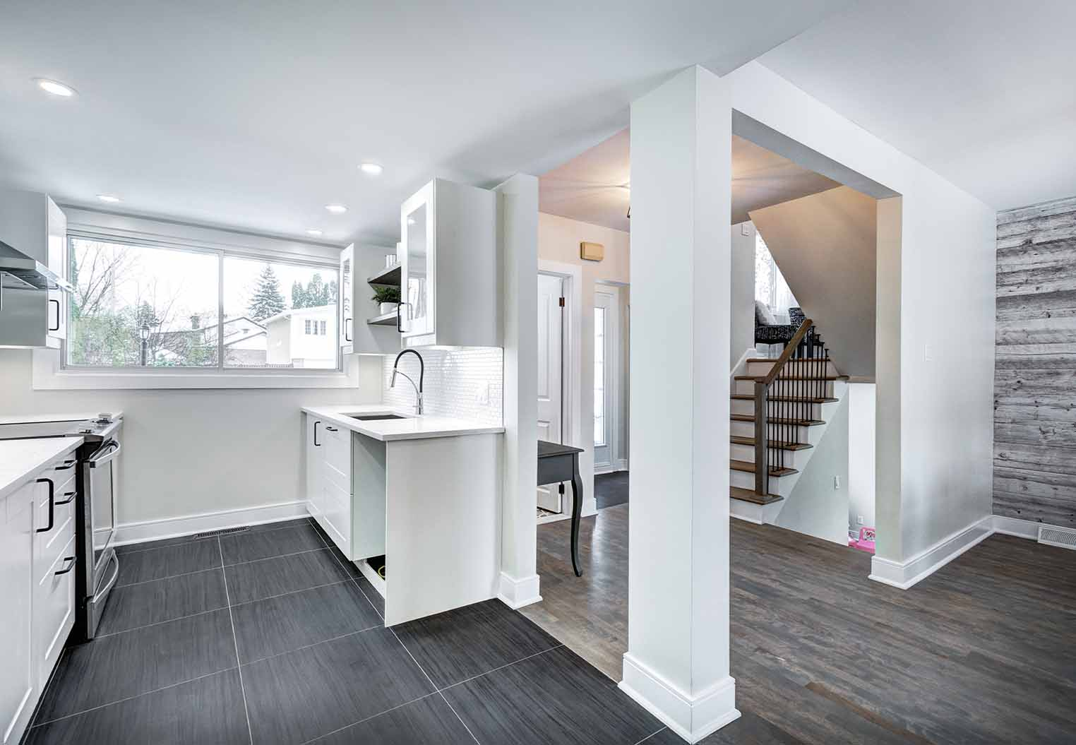 fully renovated house including kitchen, foyer, and staircase