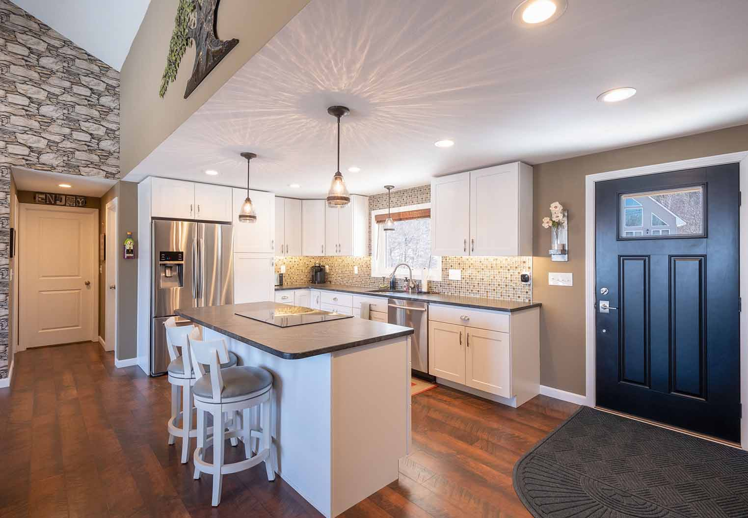 modern remodeled kitchen with island and wood floors